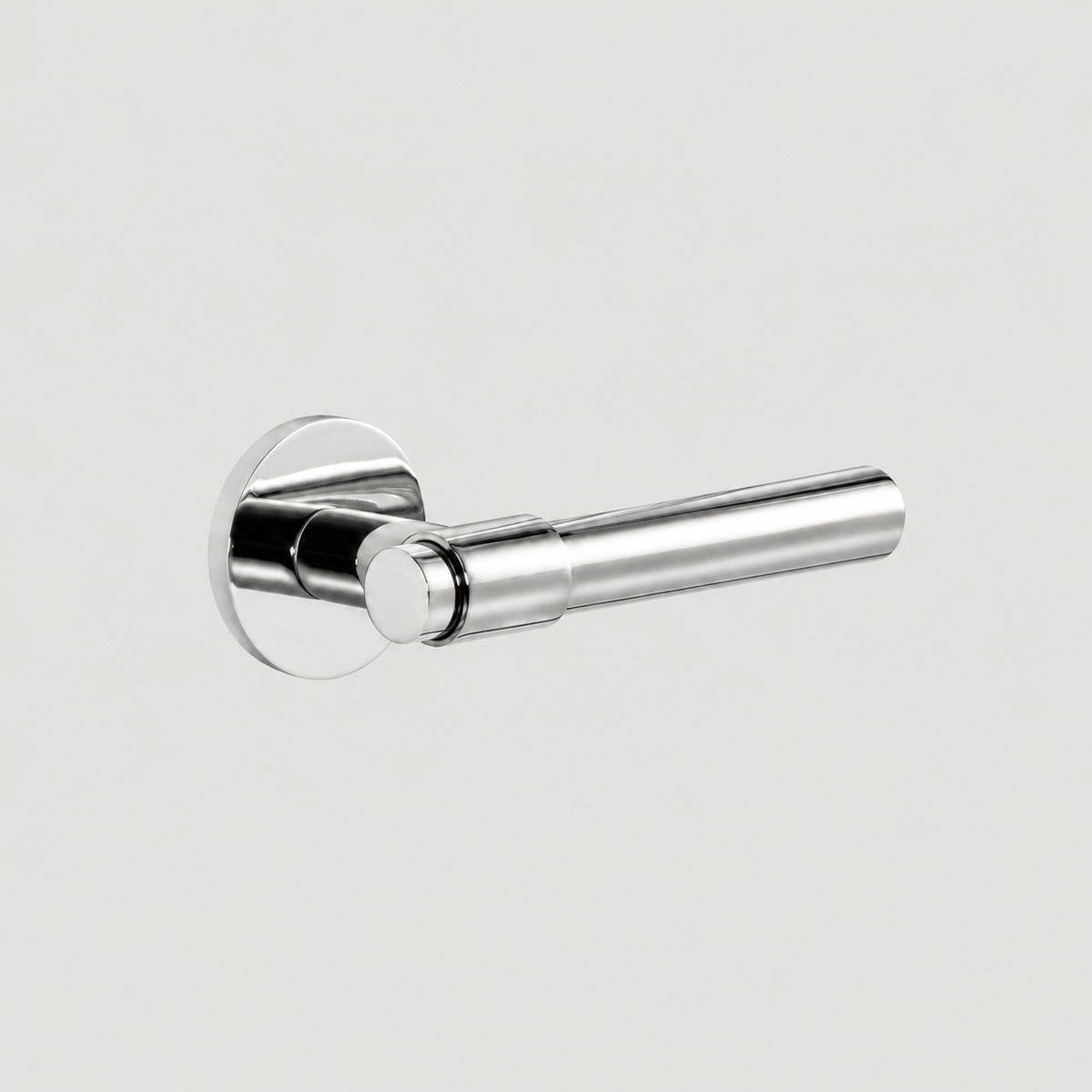 Duale polished nickel door lever with smooth cylindrical grip, stepped collar and round rose, shown in a three-quarter view.