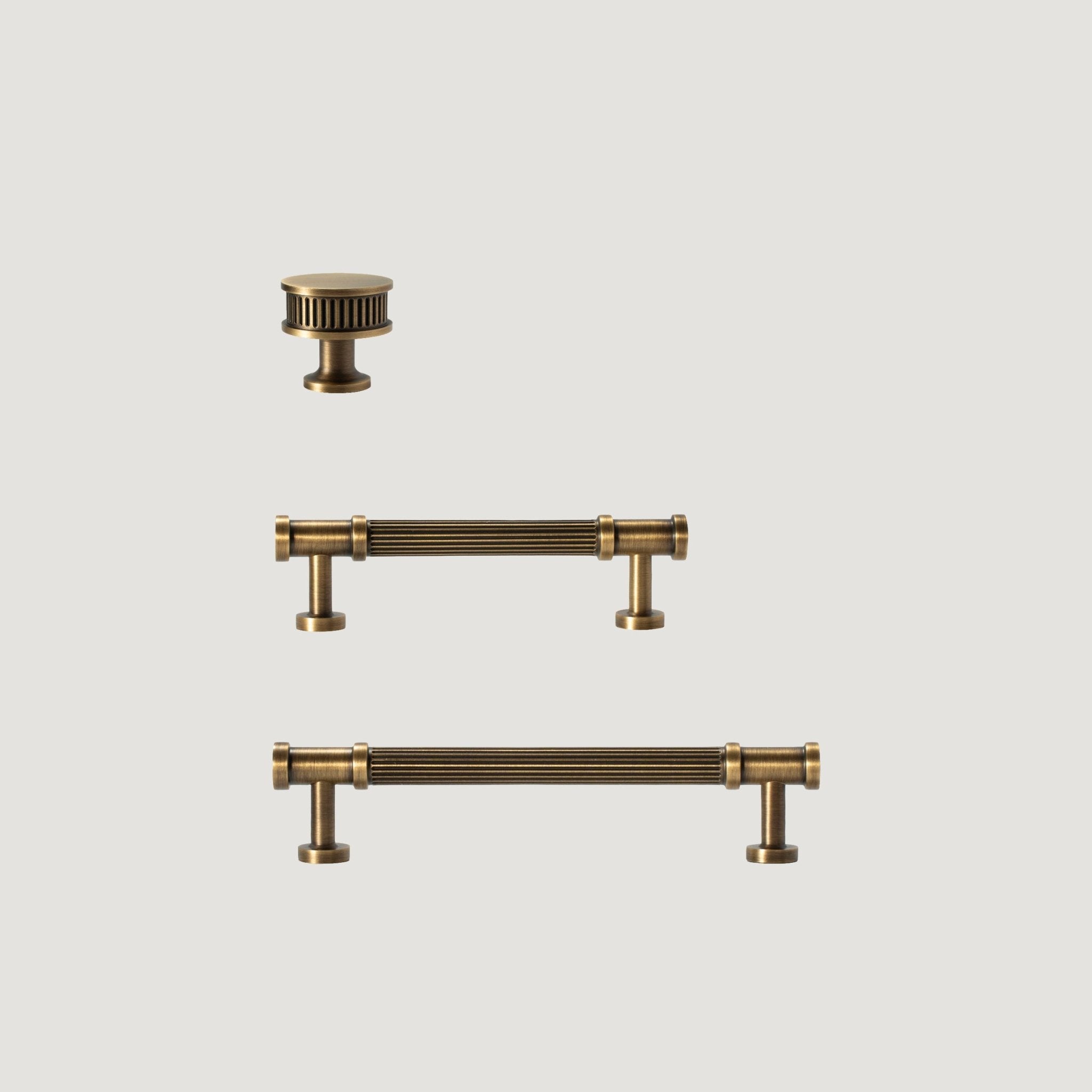 Regina solid brass cabinet handle with reeded bar and stepped classical brackets, Antique Brass, Bergamo Design