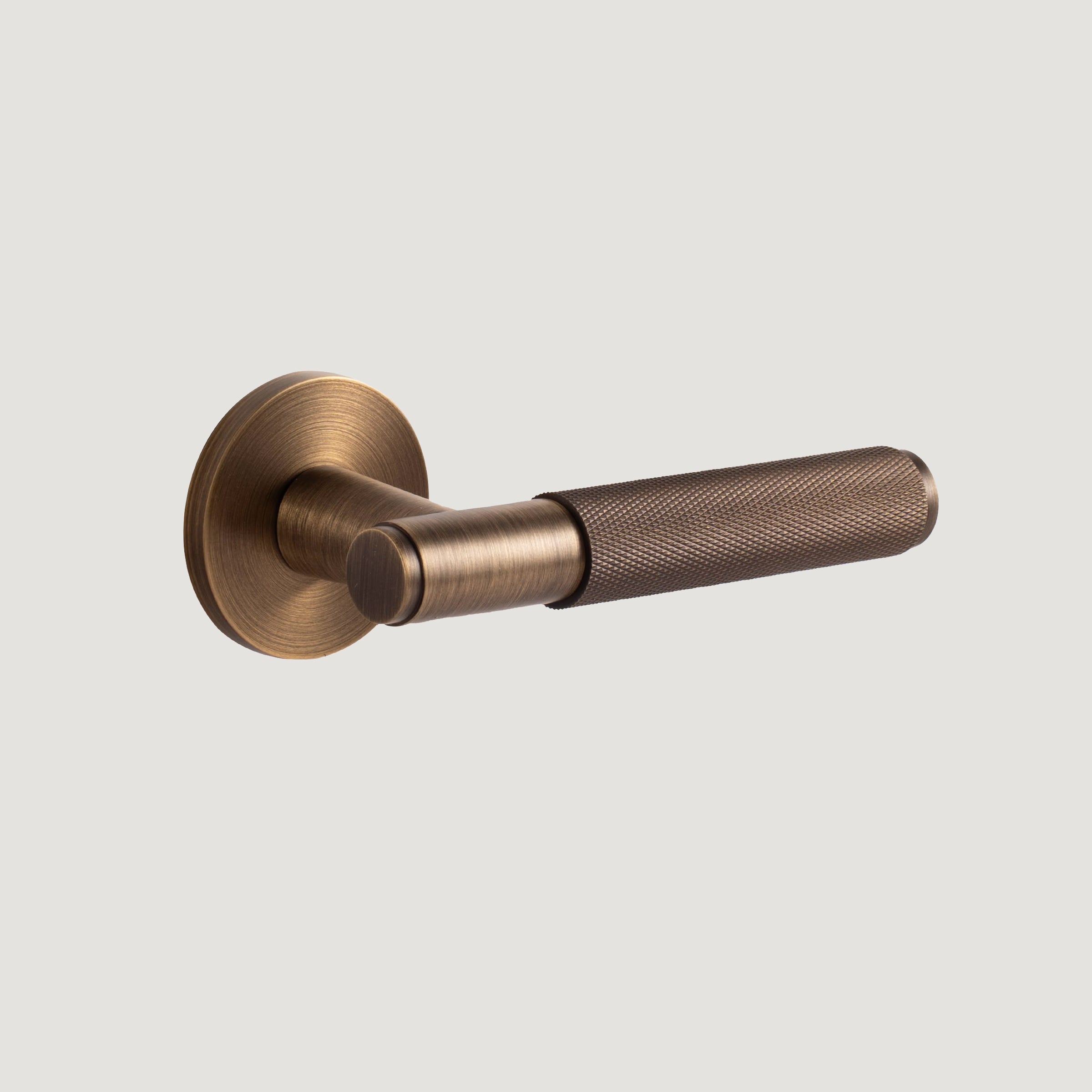 Trama solid brass door lever with substantial rose and diamond knurled grip, Antique Brass, Bergamo Design