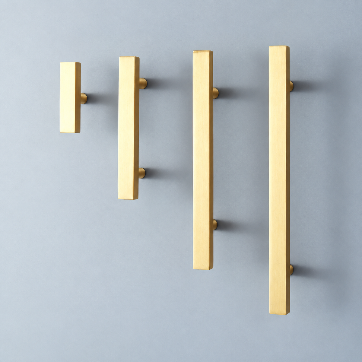 Asta Quadra Brushed Brass square cabinet handles and single-screw knob