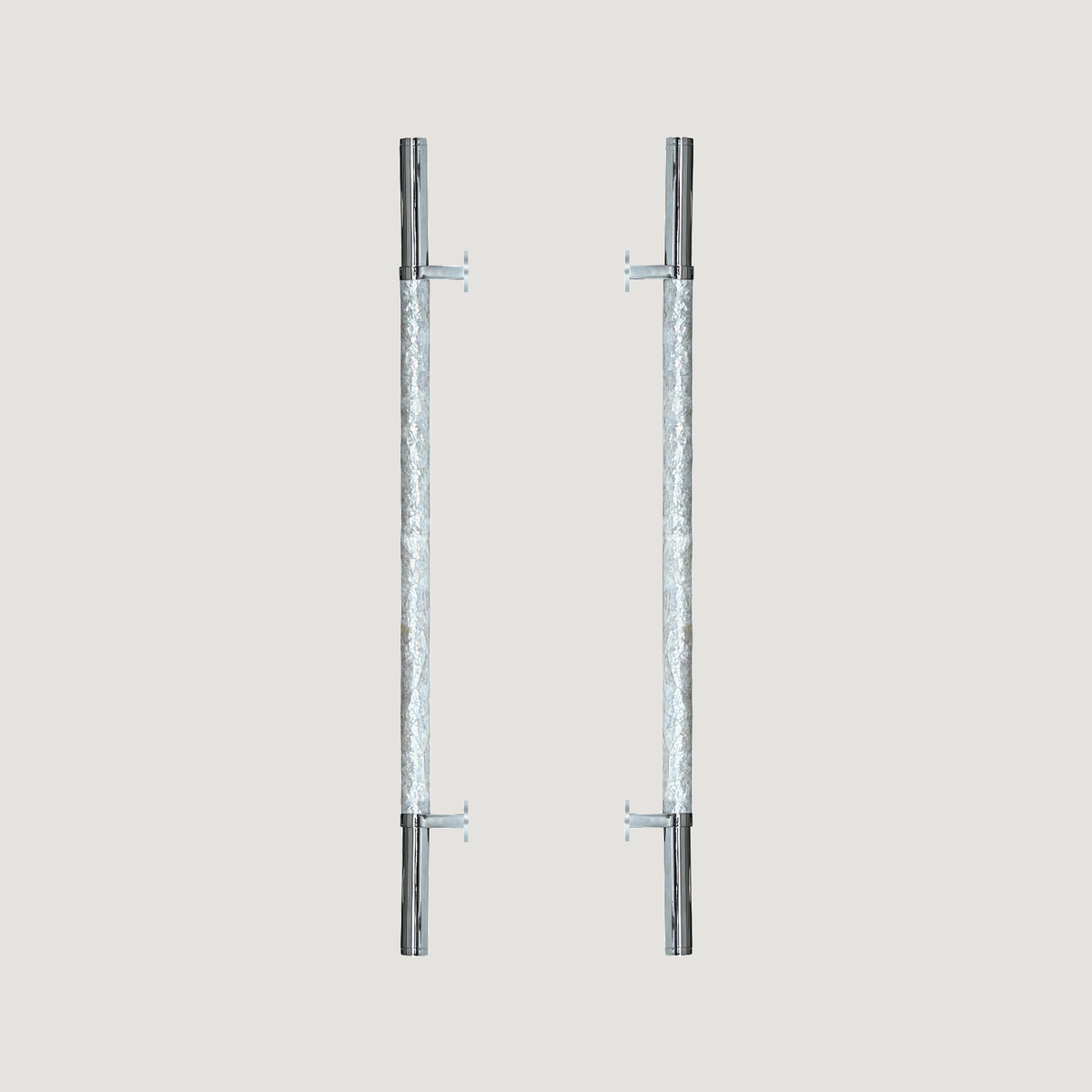 Two long front door pull handles with reflective textured grips and smooth metallic ends on a warm grey background.