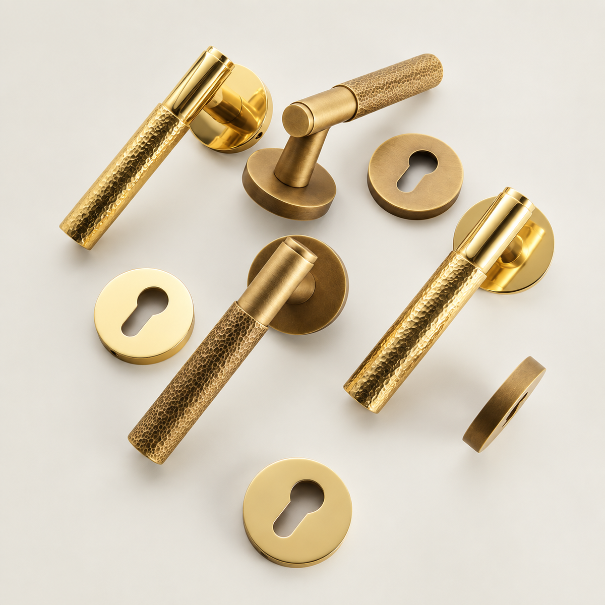 Martello hammered door levers and escutcheons in Polished Brass and Aged Brass — Bergamo Design