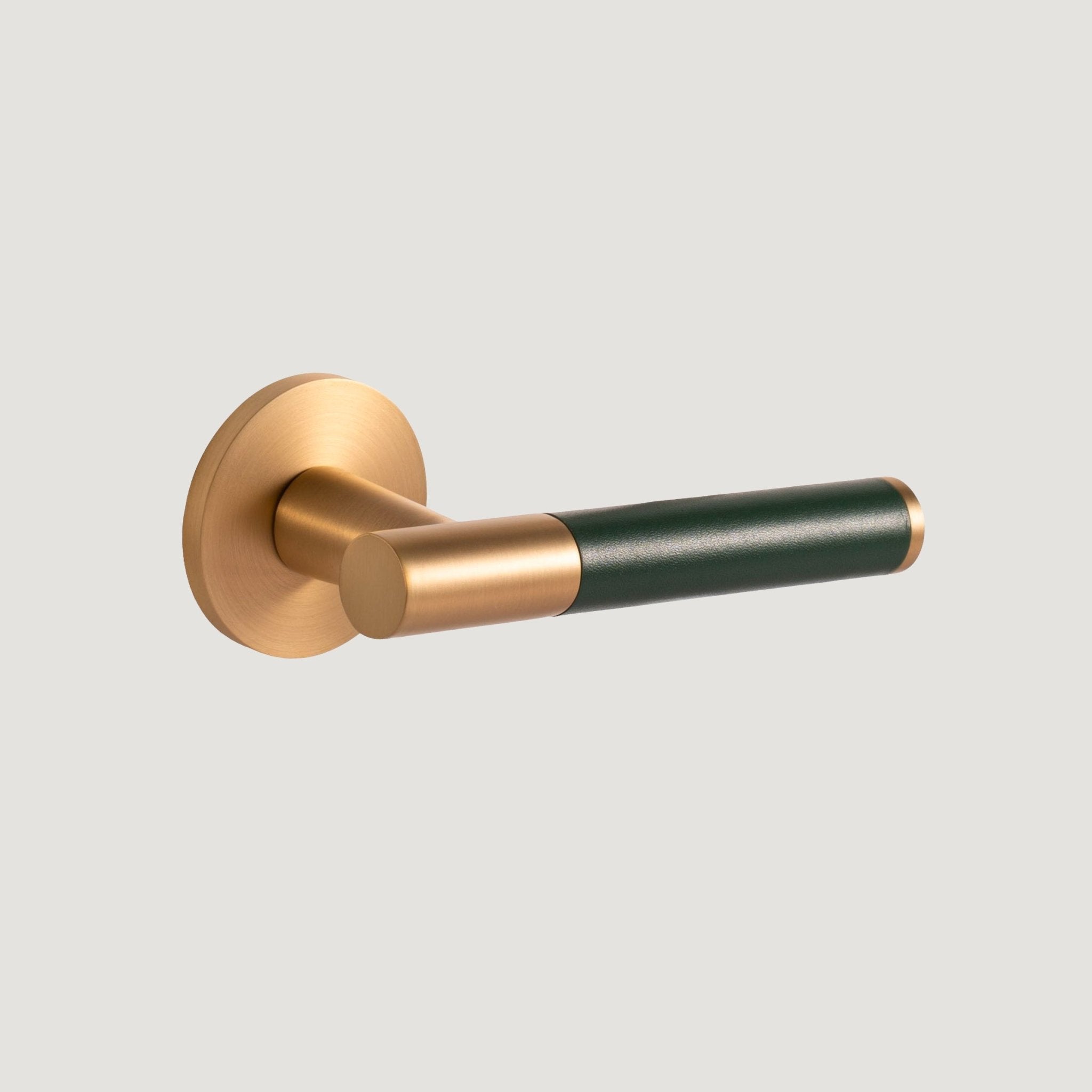 Cavallo solid brass door lever with brushed Brass proud-standing rose and hand-stitched green leather grip, Bergamo Design
