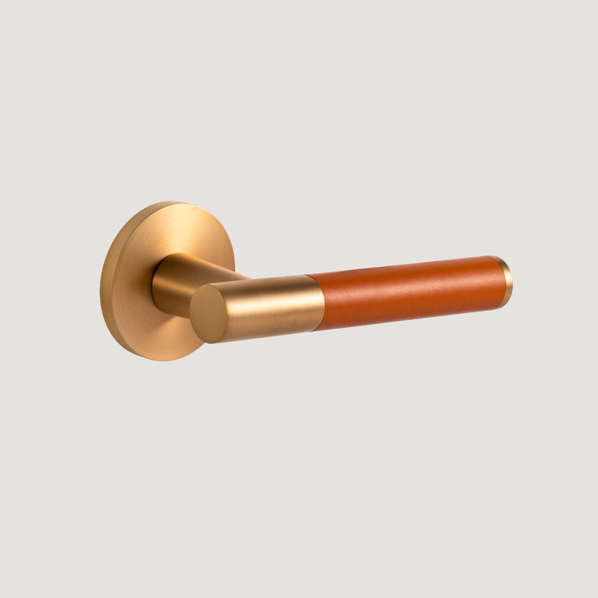 Cavallo solid brass door lever with brushed Brass proud-standing rose and hand-stitched orange leather grip, Bergamo Design